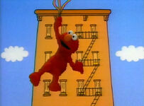 Elmo hangs on to some balloons in the 1992 closing credit sequence