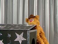 Fozzie, in an effort to stall, tells a joke with the aid of a box which he puppeteers in episode 320 of The Muppet Show.