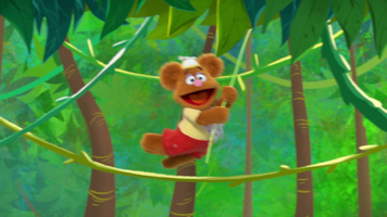 Baby Fozzie and his fellow babies swing through trees in the Muppet Babies episode "Run Fozzie Run"