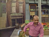 directly across from Oscar's trash can in Episode 1974.