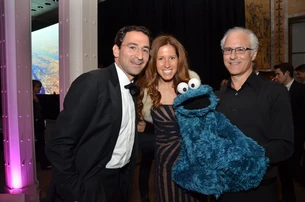 Jonathan Gray, Blackstone Group senior managing director, Mindy Gray, Cookie Monster and David Rudman, Cookie Monster performer.