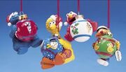 Characters holding glass ball ornaments; Big Bird, Elmo, Ernie, and Cookie Monster (2006)