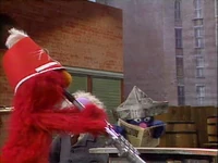 Proto-Elmo newspaper.jpg (200 KB) Grover Sells Newspapers (First: Episode 1966) (non identifiable)