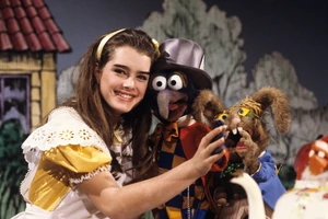 Alice with  and  as Mad Hatter