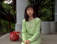 A young woman offers to help a lost Big Bird