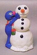 Grover building a snowman