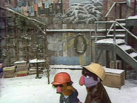 The arbor (with Biff and Sully) covered with snow in Episode 0837