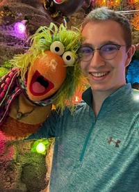 puppeteer Reese Scott with several members of the Fraggle cast