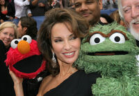 Lucci with Elmo and Oscar the Grouch at the 33rd Daytime Emmy Awards in 2006