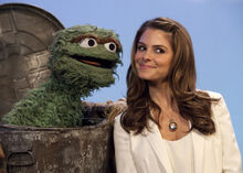 Menounos with Oscar the Grouch