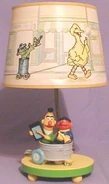 SSLampEBWashtub.jpg (17 KB) base features Ernie and Bert in a washtub lampshade features Big Bird, Oscar the Grouch, Cookie Monster and Bert & Ernie in a parade 16 inches tall