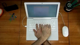 A man uses a MacBook laptop in three letter inserts in Season 39 of Sesame Street.