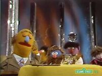 An unnamed Purple Muppet appears with the group in "Body Rhythms".