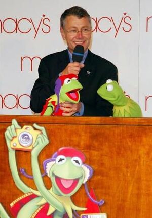 Robin Hall, director of  showing Kermit the  plush at the 2002 window unveiling.