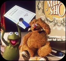 C7 Kermit signs up Fozzie's act for The Muppet Show.