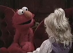 Elmo hangs with Mary Sue