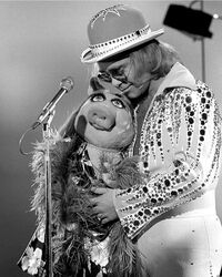 Elton piggy together