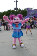 Abby in her Season 49 outfit at Sesame Place, 2021.