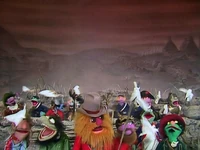 Soldiers from warring factions ask "Why Can't We Be Friends?" raising their white flags after Statler and Waldorf fire at them with a gattling gun in The Muppet Show episode 401