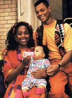 Kayla with her parents Angela and Jamal.