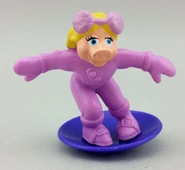 Miss Piggy on a snowboard