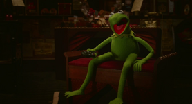 Constantine learns to impersonate Kermit.