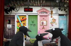 Three penguins sing "Shave and a Haircut"