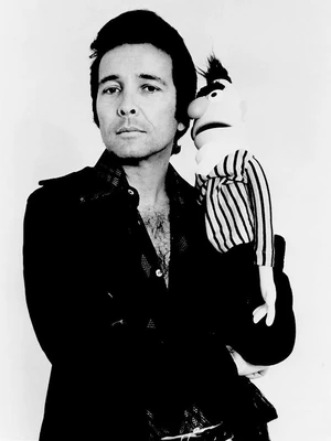 Alpert poses with  in a publicity photo for his 1974 special.