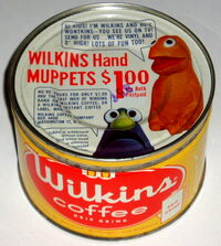 A Wilkins Coffee tin with an offer for Wilkins and Wontkins promotional puppets