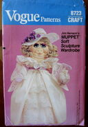 Pattern #8723 outfit for Miss Piggy soft sculpture includes long dress, shawl, pantaloons, petticoat, shoes, bag, and hat (1983)