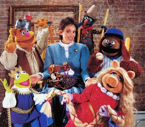 Shelly Duvall surrounded by the Muppets as Tall Tales and Faerie Tale Theatre characters