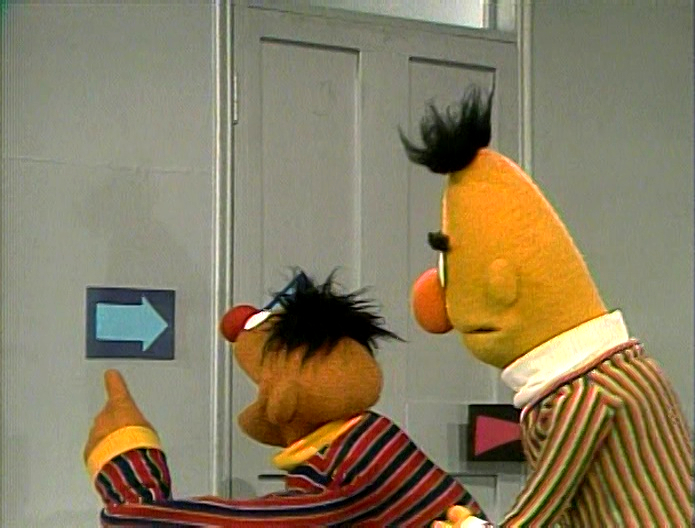 Ernie and Bert follow the arrows. "Let's All Exercise&quo...