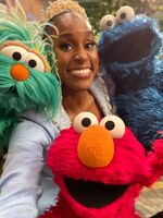 Issa Rae with Rosita, Elmo and Cookie Monster