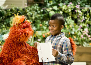 Boy+showing+Murray+his+drawing+of+visiting+his+mom-+Vaknin..jpg
