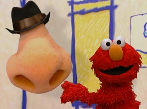 Elmo and a Jimmy Durante-ish nose.