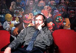 Henson poses in front of a mural by Coulter Watt that was displayed for years in the  in NYC.