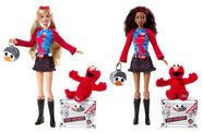 Both available Barbie dolls with their T.M.X. Elmo