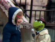 A girl tells Kermit that frogs say "wiggit wiggit". Kermit is nonplussed.