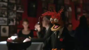 Black suit and black tie.