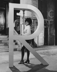 Susan with a giant letter R (re-purposed for Episode 0020)[3]