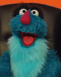 blue monster in "Monster Makeover: Rockstar Elmo"