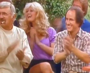 Archie the barber, with Misty Rowe and one of the Hager Brothers, watching Big Bird