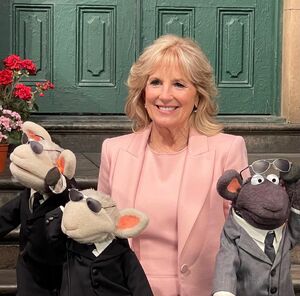  look after the First Lady during her 2022 visit to Sesame Street.