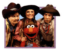 The Noodles (with Elmo) dressed as cowboys