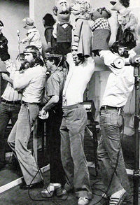 Puppeteers performing Sesame Street News Flash: Waiting in Line