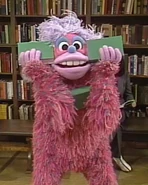 Garbo doing some juggling at the Sesame Street library.