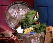 Oscar with a Playbill for "Scramalot"