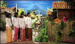Children sing along with Momon and Putri