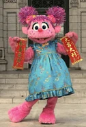 Abby in her Chinese New Year attire at Universal Studios Singapore.