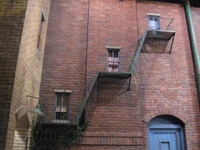The apartments on the building next to Big Bird's nest with no definite known residents (formerly the fire escape of the Furry Arms Hotel).